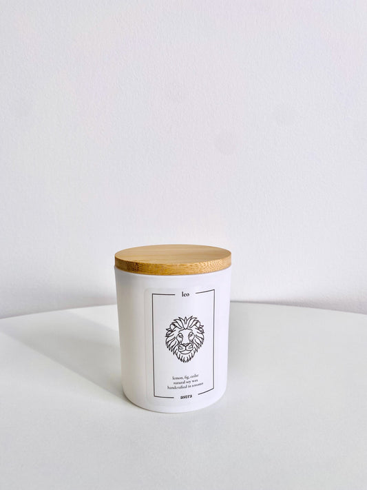 A Leo candle, depicting a lion's head, scented lemon, fig and cedar