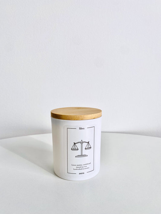 A Libra candle, depicting a balancing scale, scented lemon, jasmine and sandalwood