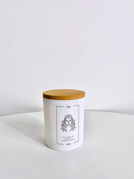 A Virgo candle, depicting a maiden's head, scented berry, cypress and cedar